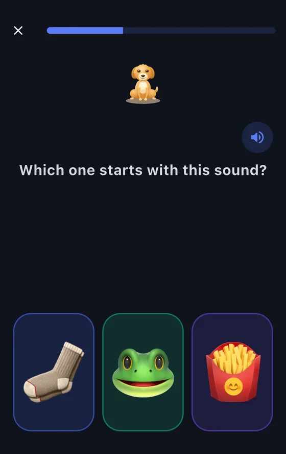 A ReadPals lesson screen at home: a dog buddy above the question “Which one starts with this sound?” and three pictures to choose from.